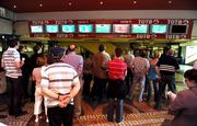 11 May 2008; Punters watch the racing from the tote hall. Derrinstown Stud Derby Trial Stakes Day, Leopardstown, Co. Dublin. Picture credit: Stephen McCarthy / SPORTSFILE