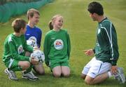 16 May 2008; Republic of Ireland and Reading star Shane Long took time out ahead of his international duty to help announce the EA Sports FAI Schools 5-A-side National Final, which will take place at Leah Victoria Park, Tullamore on May 28th. Pictured with Shane are, from left, Ciaran Clifford, age 12, Edward Sheridan age 11, and Orla Murphy, age 11, all from St Oliver Plunkett's School, Malahide, Co. Dublin. Gannon Park, Malahide, Dublin. Picture credit: Brendan Moran / SPORTSFILE