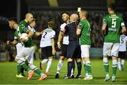 24 April 2015; Referee Rob Rogers restrains Dundalk's Richie Towell after clashing with Cork City's Billy Dennehy. SSE Airtricity League Premier Division, Cork City v Dundalk. Turners Cross, Cork. Picture credit: David Maher / SPORTSFILE