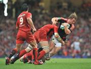 24 May 2008; Jerry Flannery, Munster, is tackled by Fabien Pelous, left, and Gregory Lamboley, Toulouse. Heineken Cup Final, Munster v Toulouse, Millennium Stadium, Cardiff, Wales. Picture credit: Brendan Moran / SPORTSFILE