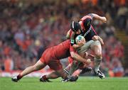 24 May 2008; Denis Leamy, Munster, is tackled by William Servat and Fabien Pelous, Toulouse. Heineken Cup Final, Munster v Toulouse, Millennium Stadium, Cardiff, Wales. Picture credit: Brendan Moran / SPORTSFILE