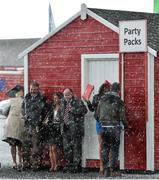 29 April 2015; Racegoers shelter during a hail shower at the day's races. Punchestown Racecourse, Punchestown, Co. Kildare. Picture credit: Matt Browne / SPORTSFILE