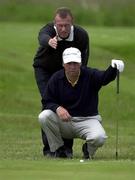 6 June 2000; Garth McGimpsey, together with his caddy Ronan T Lang, line up a putt on the 2nd during the Final Round of the East of Ireland Championship at the County Louth Golf Club in Baltray, Louth. Photo by Ray McManus/Sportsfile