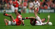 4 June 2000; Steven McDonnell of Armagh in action against Ciaran Gourley of Tyrone during the Bank of Ireland Ulster Football Championship Quarter-Final match between Tyrone and Armagh at St Tiernach's Park in Clones, Monaghan. Photo By Brendan Moran/Sportsfile