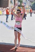 2 June 2008; Annette Kealy, Raheny Shamrocks, celebrates as she crosses the line to win the race. Women's Mini-marathon, Dublin. Picture credit: Stephen McCarthy / SPORTSFILE