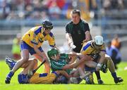 22 June 2008; Linesman Brian Gavin attempts to separate Clare players, from left, Conor Plunkett, Gerry O'Grady and Gerry Quinn from Limerick's Mike O'Brien. GAA Hurling Munster Senior Championship Semi-Final, Limerick v Clare, Semple Stadium, Thurles, Co. Tipperary. Picture credit: Brendan Moran / SPORTSFILE