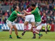 17 May 2015; Cathal Sweeney, Galway, is tackled by Leitrim forwards Fergal Clancy, left, AND Donal Wrynn, Leitrim. Connacht GAA Football Senior Championship, Quarter-Final, Leitrim v Galway. Páirc Sean Mac Diarmada, Carrick-on-Shannon, Co. Leitrim. Picture credit: Ray McManus / SPORTSFILE