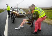 21 May 2015; David Montgomery, Team 3M, receives assistance after a crash during Stage 5 of the 2015 An Post Rás. Newport - Ballina. Photo by Sportsfile
