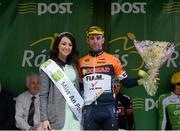 21 May 2015; Second across the line Marco Tizza, Team IDEA-CONAD, with Miss An Post Rás Donna McCaffrey following Stage 5 of the 2015 An Post Rás. Newport - Ballina. Photo by Sportsfile