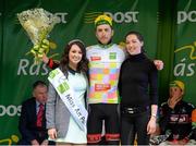 21 May 2015; Robert Partridge after receiving the One4All Bikes4Work King of the Mountains Jersey Classification from Miss An Post Rás Donna McCaffrey and Maria Connaughton, Spin11, following Stage 5 of the 2015 An Post Rás. Newport - Ballina. Photo by Sportsfile