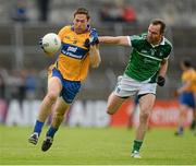 23 May 2015; Gary Brennan, Clare, holds off the challenge of Thomas Lee, Limerick. Munster GAA Football Senior Championship Quarter-Final, Clare v Limerick, Cusack Park, Ennis, Co. Clare. Picture credit: Brendan Moran / SPORTSFILE