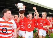 13 July 2008; Brian Collins, Cork, accompanied by team-mates Darren McCarthy, left, and Eoin Moynihan, right, lifts the cup. ESB Munster Minor Hurling Championship Final, Tipperary v Cork, Gaelic Grounds, Limerick. Picture credit: Pat Murphy / SPORTSFILE