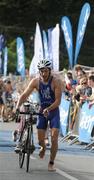 12 July 2008; Eventual winner of the Men's Elite Race Vincent Luis, France, after passing through the transition zone between the swimming and cycling discipline at the triAthlone event. Over 1,500 competitors took part in the third running of triAthlone sponsored by Waterways Ireland. triAthlone will host the European Triathlon Championships in 2010, the first time the event has ever been held in Ireland. Waterways Ireland triAthlone Triathlon, Athlone, Co. Westmeath. Picture credit: Stephen McCarthy / SPORTSFILE