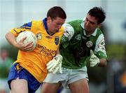 4 June 2000; Gerry Lohan of Roscommon is tackled by Colin McCarthy of London during the Bank of Ireland Connacht Senior Football Championship Quarter-Final match between London and Roscommon at Emerald GAA Grounds in Ruislip, London, England. Photo by Aoife Rice/Sportsfile