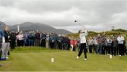 27 May 2015; AP McCoy hits his first shot from the 2nd tee watched by Patrick Kielty, extreme left. Dubai Duty Free Irish Open Golf Championship 2015, Pro-Am. Royal County Down Golf Club, Co. Down. Picture credit: Oliver McVeigh / SPORTSFILE