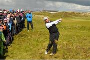28 May 2015; Shane Lowry, Ireland, hits his second shot from the 8th fairway. Dubai Duty Free Irish Open Golf Championship 2015, Day 1. Royal County Down Golf Club, Co. Down. Picture credit: Ramsey Cardy / SPORTSFILE