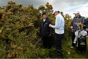 29 May 2015; Rory McIlroy, Northern Ireland, speaks with an official after his ball went off the 18th fairway. Dubai Duty Free Irish Open Golf Championship 2015, Day 2. Royal County Down Golf Club, Co. Down. Picture credit: Ramsey Cardy / SPORTSFILE