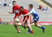 19 July 2008; Paddy Bradley, Derry, in action against Darren Hughes, Monaghan. GAA Football All-Ireland Senior Championship Qualifier - Round 1, Monaghan v Derry, Clones, Co. Monaghan. Picture credit: Oliver McVeigh / SPORTSFILE