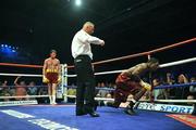 19 July 2008; Andy Lee, left, knocks down Willie Gibbs during the final round. International Middleweight contest, University Sports Arena, Limerick. Picture credit: David Maher / SPORTSFILE