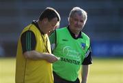 12 July 2008; Limerick manager Richie Bennis and coach Gary Kirby, left, check the time remaining in the game. GAA Hurling All-Ireland Senior Championship Qualifier, Round 3, Limerick v Offaly, Gaelic Grounds, Limerick. Picture credit: Ray McManus / SPORTSFILE