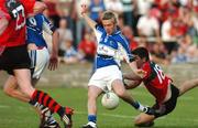 26 July 2008; Laois' Michael Tierney has a last minute shot at goal despite the tackle of Down's Peter Turley. GAA Football All-Ireland Senior Championship Qualifier, Round 2, Laois v Down, O'Moore Park, Portlaoise. Picture credit: Maurice Doyle / SPORTSFILE