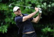 29 July 2008; Girvan Dempsey watches his tee shot from the 1st tee box during the BT IRUPA Rugby Players Golf Classic. Elm Park Golf Club, Dublin. Picture credit: Brian Lawless / SPORTSFILE