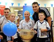 1 August 2008; Dublin stars Paul Casey, left, Shane Ryan, centre, and Bernard Brogan with Dublin supporters Saoirse Roche, age 3, and her brother Patrick, age 5, alongside the Delaney Cup, during a visit to the Halifax branch at Nutgrove Shopping Centre, Rathfarnham, Dublin, with the Delany Cup, where they met and chatted with fans while signing autographs. Picture credit: Pat Murphy / SPORTSFILE