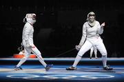 9 August 2008; Siobhan Byrne, right, Ireland, celebrates winning a point against Irena Wieckowska, Poland, to whom she lost 15-8. Beijing 2008 - Games of the XXIX Olympiad, Fencing Hall of National Convention Centre, Olympic Green, Beijing, China. Picture credit: Brendan Moran / SPORTSFILE