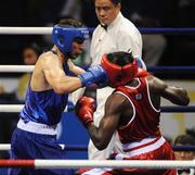 9 August 2008; Ken Egan, Ireland, in action against Julius Jackson, red, Virgin Islands, during the first round of the Light heavy weight, 81 kg, contest. Beijing 2008 - Games of the XXIX Olympiad, Beijing Workers Gymnasium, Olympic Green, Beijing, China. Picture credit: Ray McManus / SPORTSFILE