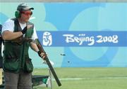 9 August 2008; Ireland's Derek Burnett disposes of his spent cartridges during Men's Trap Qualification. Beijing 2008 - Games of the XXIX Olympiad, Beijing Shooting Range, Xiangshan nan Road, Haidian District, Beijing, China. Picture credit: Brendan Moran / SPORTSFILE