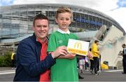 13 June 2015; Pictured is Daniel Gill, aged 7, from Newbridge, Co. Kildare, alongside his dad Ken at the Aviva Stadium. Daniel won a McDonald’s Future Football competition for a special trip to Ireland v Scotland European Championship Qualifier at the Aviva Stadium. McDonald’s FAI Future Football is a programme designed to support grassroots football clubs by enriching the work they do at local level. Over 10,000 boys and girls from 165 football clubs in Ireland will take part this year, generating 70,000 additional hours of activity. UEFA EURO 2016 Championship Qualifier, Group D, Republic of Ireland v Scotland, Aviva Stadium, Lansdowne Road, Dublin. Picture credit: Ramsey Cardy / SPORTSFILE