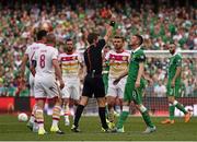 13 June 2015; James McCarthy, Republic of Ireland, receives a yellow card from referee Nicola Rizzoli after his challenge on Russell Martin, Scotland. UEFA EURO 2016 Championship Qualifier, Group D, Republic of Ireland v Scotland, Aviva Stadium, Lansdowne Road, Dublin. Picture credit: David Maher / SPORTSFILE