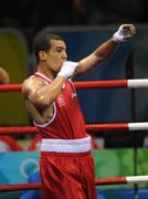 16 August 2008; Darren Sutherland, Ireland, celebrates victory over Nabil Kassel, from Algeria, during the 'round of 16' Middle weight, 75kg, contest. Beijing 2008 - Games of the XXIX Olympiad, Beijing Workers Gymnasium, Olympic Green, Beijing, China. Picture credit: Ray McManus / SPORTSFILE