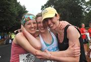 16 August 2008; Sisters Marguerite, Sarah Jo and Carroll Sinnott, from Wexford, after crossing the finish line in the Lifestyle adidas Race Series - Frank Duffy 10 Mile Road Race. Phoenix Park, Dublin. Picture credit: Ray Lohan / SPORTSFILE  *** Local Caption ***