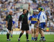 17 August 2008; Referee Diarmuid Kirwan issues Waterford's Aidan Kearney with a yellow card. GAA Hurling All-Ireland Senior Championship Semi-Final, Tipperary v Waterford, Croke Park, Dublin. Picture credit: Brian Lawless / SPORTSFILE