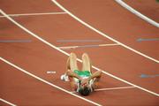 20 August 2008; Alistair Cragg, 2041, Ireland, lies on the track after his heat of the Men's 5000m, where he finished 6th in a time of 13:38.57 and qualified for the final. Beijing 2008 - Games of the XXIX Olympiad, National Stadium, Olympic Green, Beijing, China. Picture credit: Brendan Moran / SPORTSFILE