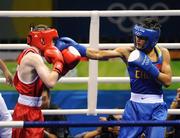 22 August 2008; Paddy Barnes, Ireland, is caught by Zou Sheming, in blue, China, during the first round of their semi-final bout in the Light Fly weight, 48kg, contest. Beijing 2008 - Games of the XXIX Olympiad, Beijing Workers' Gymnasium, Olympic Green, Beijing, China. Picture credit: Brendan Moran / SPORTSFILE