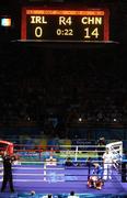 22 August 2008; Paddy Barnes, Ireland, goes down on his knees in the last seconds against Zou Sheming, in blue, China, during their semi-final bout in the Light Fly weight, 48kg, contest. Beijing 2008 - Games of the XXIX Olympiad, Beijing Workers' Gymnasium, Olympic Green, Beijing, China. Picture credit: Brendan Moran / SPORTSFILE
