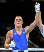 18 June 2015; Luke McCormack, Great Britain, is declared victorious over Panagiotis Matsagkos, Greece, following their Men's Boxing Light 60kg Round of 32 bout. 2015 European Games, Crystal Hall, Baku, Azerbaijan. Picture credit: Stephen McCarthy / SPORTSFILE