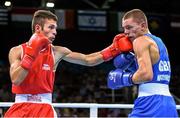 18 June 2015; Panagiotis Matsagkos, Greece, left, exchanges punches with Luke McCormack, Great Britain, during their Men's Boxing Light 60kg Round of 32 bout. 2015 European Games, Crystal Hall, Baku, Azerbaijan. Picture credit: Stephen McCarthy / SPORTSFILE
