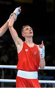 19 June 2015; Brendan Irvine, Ireland, is declared victorious following his Men's Boxing Light Fly 49kg Round of 16 bout with Tinko Banabakov, Bulgaria. 2015 European Games, Crystal Hall, Baku, Azerbaijan. Picture credit: Stephen McCarthy / SPORTSFILE
