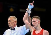 19 June 2015; Brendan Irvine, Ireland, is declared victorious by referee Referee Tariel Gogotchuri following his Men's Boxing Light Fly 49kg Round of 16 bout with Tinko Banabakov, Bulgaria. 2015 European Games, Crystal Hall, Baku, Azerbaijan. Picture credit: Stephen McCarthy / SPORTSFILE