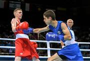 19 June 2015; Brendan Irvine, Ireland, left, exchanges punches with Tinko Banabakov, Bulgaria, during their Men's Boxing Light Fly 49kg Round of 16 bout. 2015 European Games, Crystal Hall, Baku, Azerbaijan. Picture credit: Stephen McCarthy / SPORTSFILE