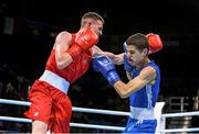 19 June 2015; Brendan Irvine, Ireland, left, exchanges punches with Tinko Banabakov, Bulgaria, during their Men's Boxing Light Fly 49kg Round of 16 bout. 2015 European Games, Crystal Hall, Baku, Azerbaijan. Picture credit: Stephen McCarthy / SPORTSFILE