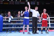 19 June 2015; Ceire Smith, Ireland, is declared victorious, by referee Denis Popov, over Camilla Johansen, Norway, following their Women's Boxing Fly 51kg Round of 16 bout. 2015 European Games, Crystal Hall, Baku, Azerbaijan. Picture credit: Stephen McCarthy / SPORTSFILE