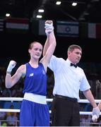 19 June 2015; Ceire Smith, Ireland, is declared victorious, by referee Denis Popov, over Camilla Johansen, Norway, following their Women's Boxing Fly 51kg Round of 16 bout. 2015 European Games, Crystal Hall, Baku, Azerbaijan. Picture credit: Stephen McCarthy / SPORTSFILE