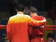 24 August 2008; Ireland's Kenneth Egan is consoled by gold medal winner Xiapoing, China, as they leave the ring after the presentation of medals in the Light Heavy weight, 81kg, category. Beijing 2008 - Games of the XXIX Olympiad, Beijing Workers' Gymnasium, Olympic Green, Beijing, China. Picture credit: Ray McManus / SPORTSFILE