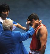 24 August 2008; Kenneth Egan, Ireland, is consoled by officials after his bout with Xiaoping Zhang, China, in the Light Heavy weight Final, 81kg, contest. Beijing 2008 - Games of the XXIX Olympiad, Beijing Workers' Gymnasium, Olympic Green, Beijing, China. Picture credit: Ray McManus / SPORTSFILE