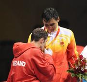 24 August 2008; Ireland's Kenneth Egan kisses the gold medal of his victor, Xiaoping Zhang, China, during the medal presentation of the Light Heavy weight, 81kg, category. Beijing 2008 - Games of the XXIX Olympiad, Beijing Workers' Gymnasium, Olympic Green, Beijing, China. Picture credit: Brendan Moran / SPORTSFILE