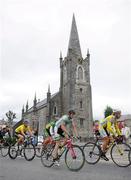 30 August 2008; Riders, from left, Graham Briggs, Rapha Condor Recycling.co.uk, Mark Cavendish, Team Columbia, Roger Aiken, Irish National Team, and Bernardo Luca, Tinkoff-Credit Systems, pass a church in Listowel, Co. Kerry. 2008 Tour of Ireland - Stage 4, Limerick - Dingle. Picture credit: Stephen McCarthy / SPORTSFILE